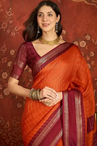 Orange silk cotton zari checks saree with unstitched blouse piece.