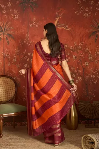 Orange silk cotton zari checks saree with unstitched blouse piece.