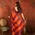 Orange silk cotton zari checks saree with unstitched blouse piece.
