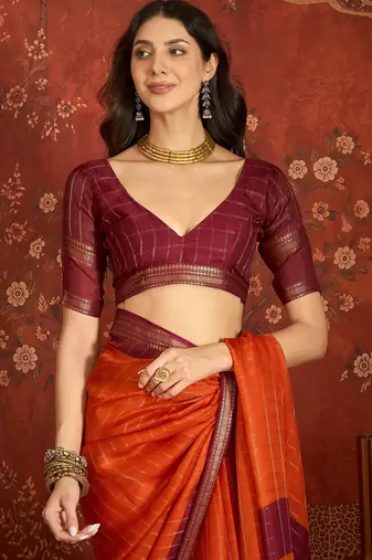 Orange silk cotton zari checks saree with unstitched blouse piece.