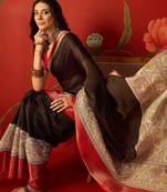 Black silk cotton zari checks saree with unstitched blouse piece.