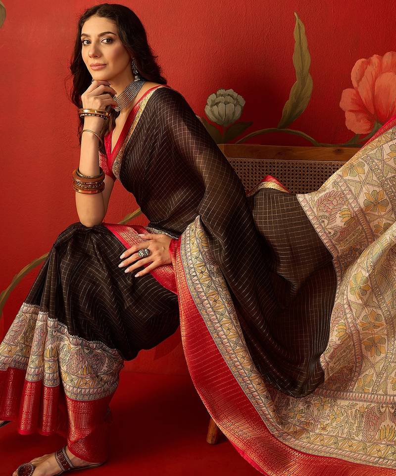 Black silk cotton zari checks saree with unstitched blouse piece.