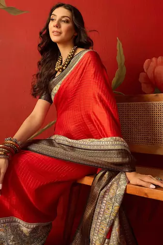 Red silk cotton zari checks saree with unstitched blouse piece.