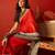 Red silk cotton zari checks saree with unstitched blouse piece.