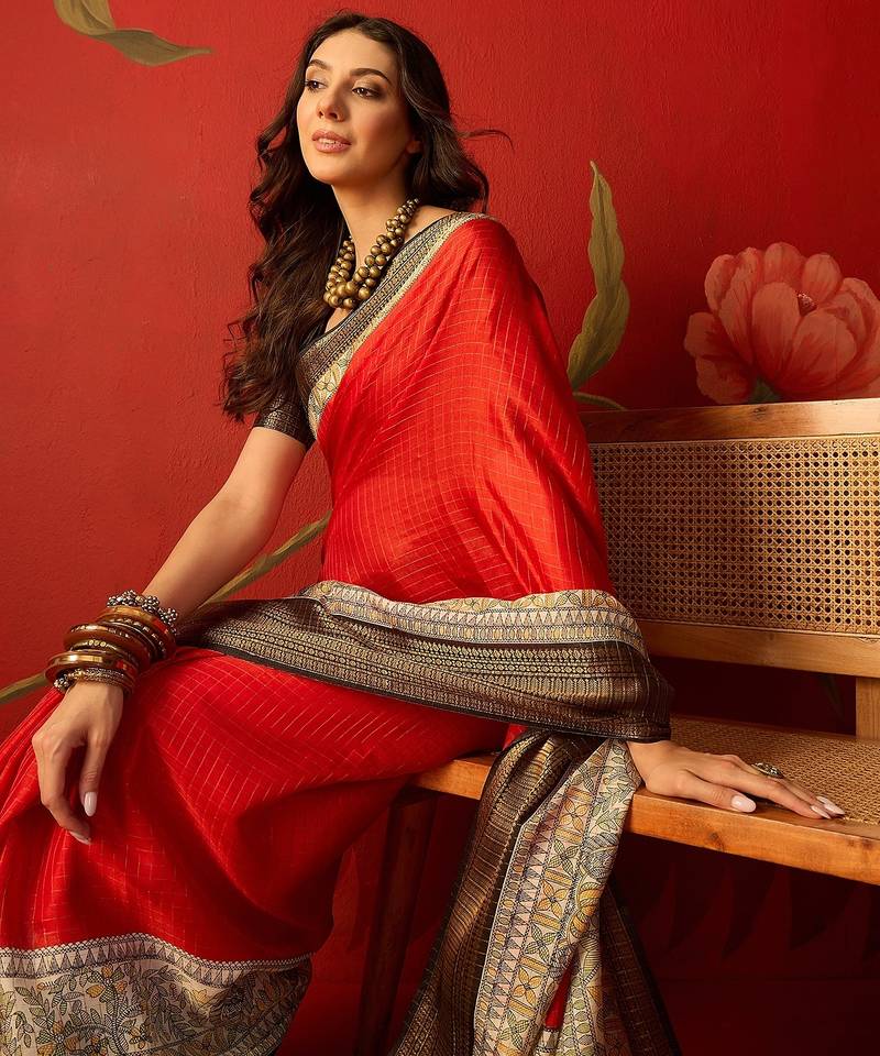 Red silk cotton zari checks saree with unstitched blouse piece.