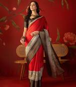 Red silk cotton zari checks saree with unstitched blouse piece.