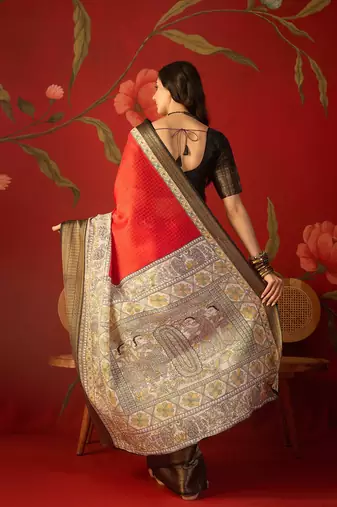 Red silk cotton zari checks saree with unstitched blouse piece.