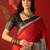 Red silk cotton zari checks saree with unstitched blouse piece.