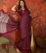 Wine silk cotton printed saree with unstitched blouse piece.