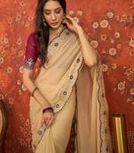 Beige chiffon embroidered saree with unstitched blouse piece.