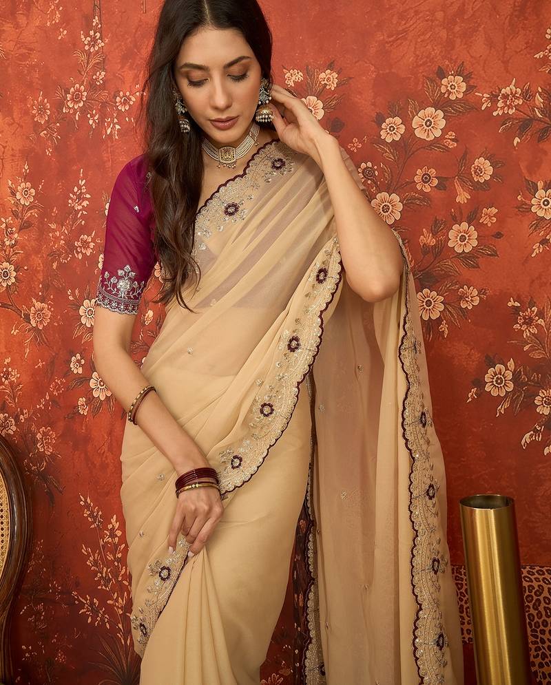 Beige chiffon embroidered saree with unstitched blouse piece.