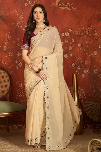 Beige chiffon embroidered saree with unstitched blouse piece.