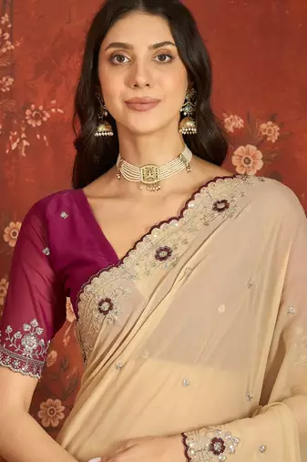 Beige chiffon embroidered saree with unstitched blouse piece.