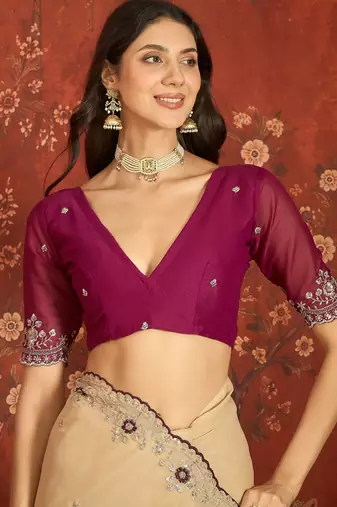 Beige chiffon embroidered saree with unstitched blouse piece.