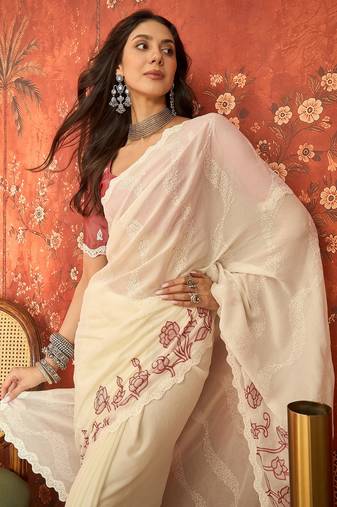 Cream chiffon embroidered saree with unstitched blouse piece.