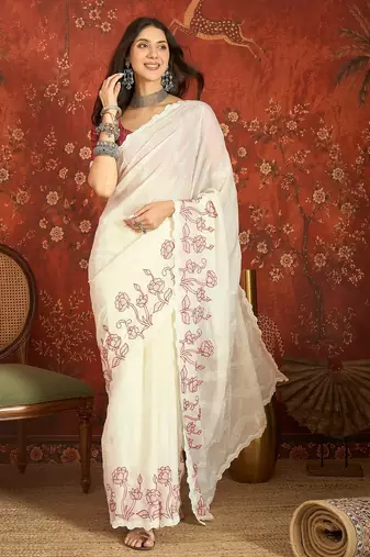 Cream chiffon embroidered saree with unstitched blouse piece.