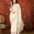 Cream chiffon embroidered saree with unstitched blouse piece.