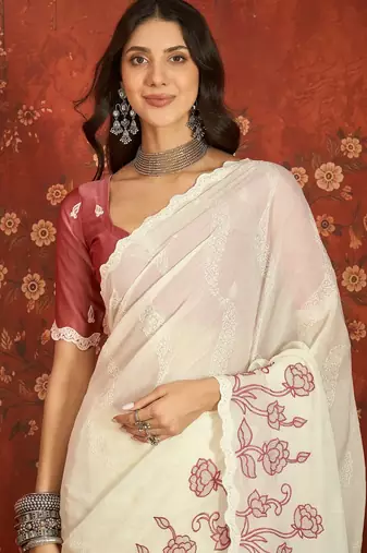 Cream chiffon embroidered saree with unstitched blouse piece.