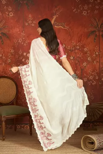 Cream chiffon embroidered saree with unstitched blouse piece.