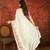 Cream chiffon embroidered saree with unstitched blouse piece.