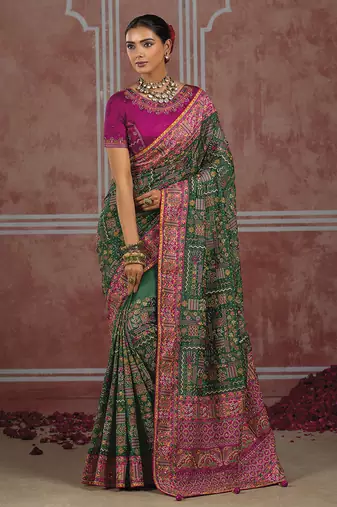 Bottle green silk blend saree with intricate zari & meenakari weaving