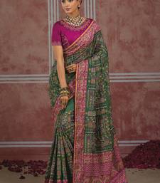 Bottle green silk blend saree with intricate zari & meenakari weaving