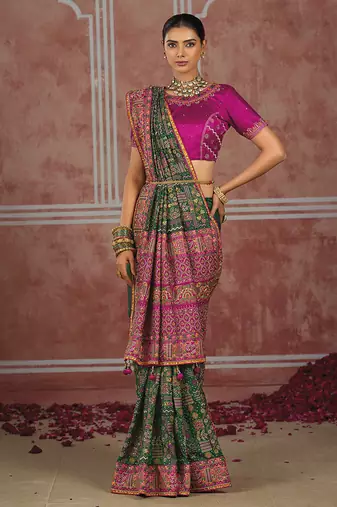 Bottle green silk blend saree with intricate zari & meenakari weaving
