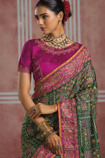 Bottle green silk blend saree with intricate zari & meenakari weaving