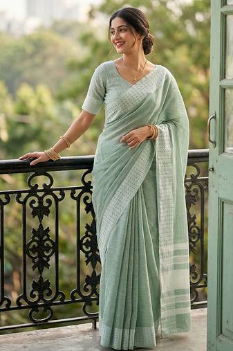 Sea green cotton silk blend saree with intricate woven border