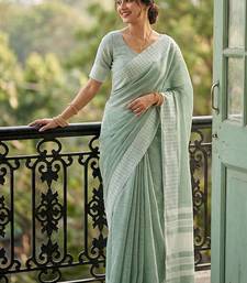 Sea green cotton silk blend saree with intricate woven border