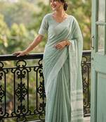 Sea green cotton silk blend saree with intricate woven border