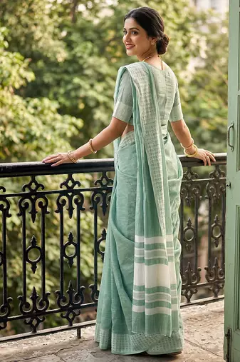 Sea green cotton silk blend saree with intricate woven border
