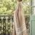 Beige cotton silk blend saree with intricate woven border
