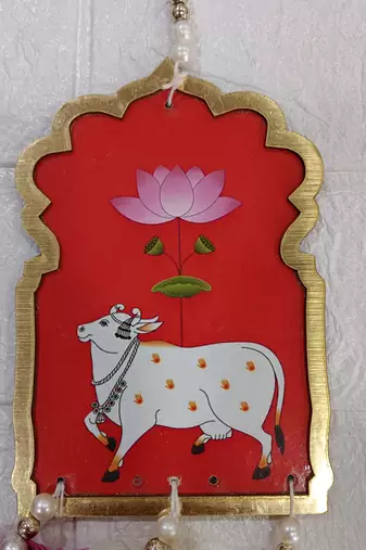 handmade cow mdf door hanging with artificial flowers traditional festive decoration pack of 2