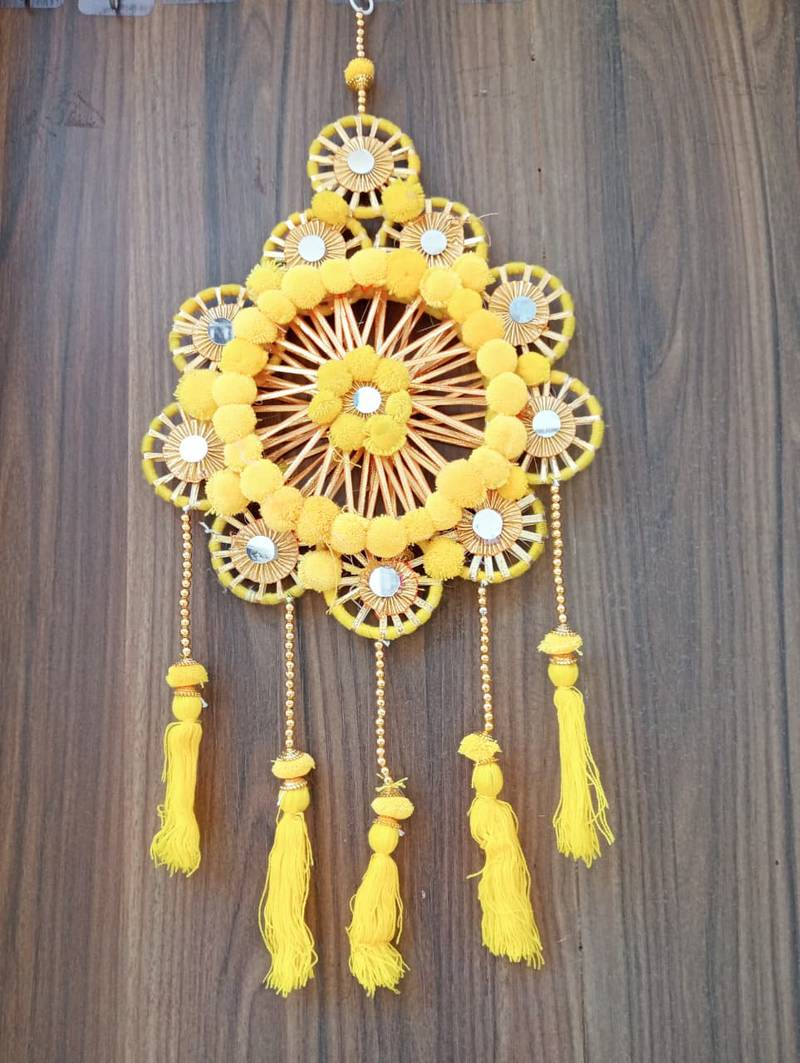 traditional yellow pom-pom decorative hanging with golden beads for door wall festive home decoration