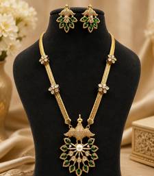 Elegant green kundan style long necklace set with peacock pendant & matching earrings