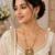 Elegant green kundan style long necklace set with peacock pendant & matching earrings
