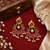 Gold plated peacock chandbali earrings with pink green stones & pearl drops