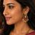 Gold plated peacock chandbali earrings with pink green stones & pearl drops