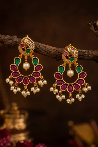 Gold plated peacock chandbali earrings with pink green stones & pearl drops