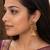 Gold plated kemp jhumka earrings with ruby green stones & pearl drops for women