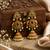 Gold plated kemp jhumka earrings with ruby green stones & pearl drops for women