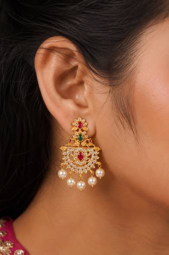 Gold plated designer chandbali earrings with ruby green stones & pearl drops