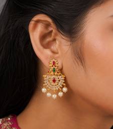 Gold plated designer chandbali earrings with ruby green stones & pearl drops
