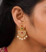 Gold plated designer chandbali earrings with ruby green stones & pearl drops