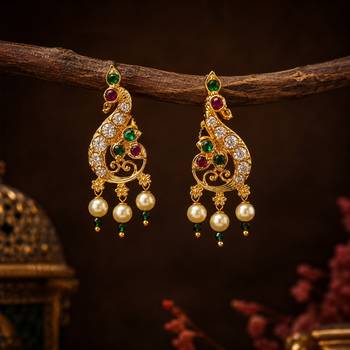 Gold plated peacock designer earrings with ruby green stones & pearl drops 1
