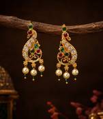 Gold plated peacock designer earrings with ruby green stones & pearl drops