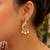 Gold plated peacock designer earrings with ruby green stones & pearl drops