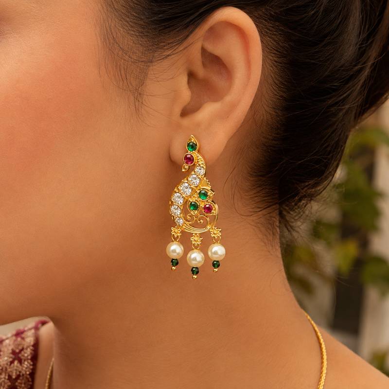 Gold plated peacock designer earrings with ruby green stones & pearl drops