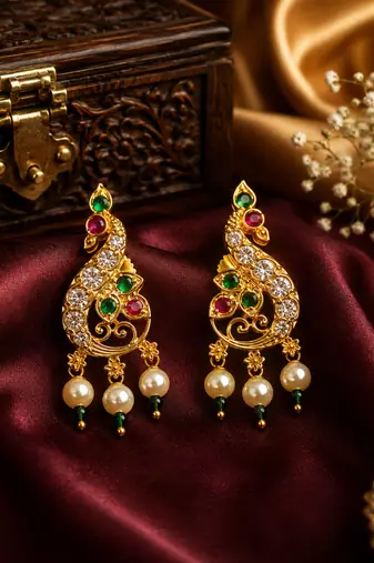 Gold plated peacock designer earrings with ruby green stones & pearl drops